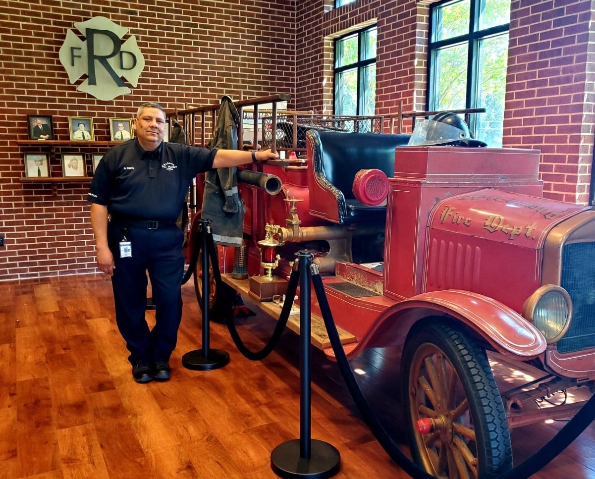 Albert Cantu retirement photo with old engine