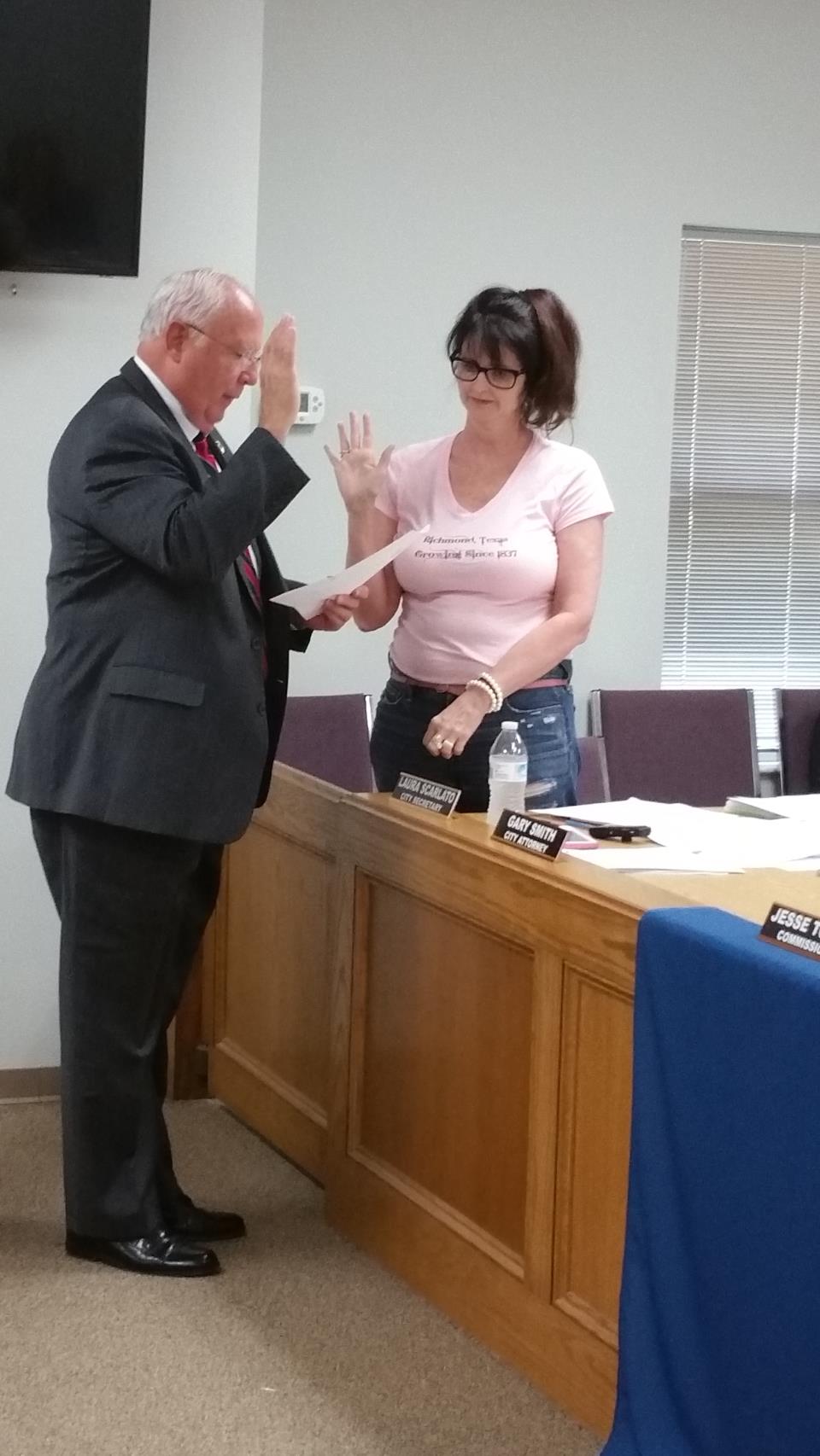 Commissioner Beard being sworn in (v)